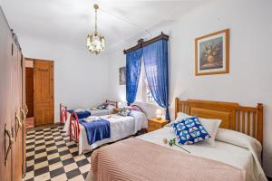 Posteľ alebo postele v izbe v ubytovaní Casa Amelia y Juan de Dios + 25 fotografií