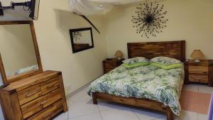 Maison Ambre Guesthouse tesisinde bir odada yatak veya yataklar