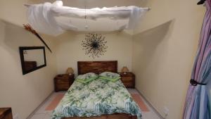 Maison Ambre Guesthouse tesisinde bir odada yatak veya yataklar