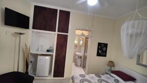 Maison Ambre Guesthouse tesisinde bir odada yatak veya yataklar