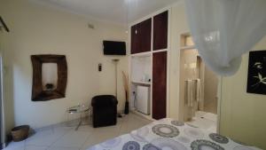 Maison Ambre Guesthouse tesisinde bir odada yatak veya yataklar