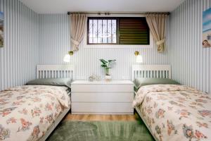 Giường trong phòng chung tại Luxury Palm Tenerife +16 ảnh