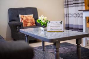 a table with a sign on top of it at 2 BR, TreasureTree Homes, Thika. in Thika
