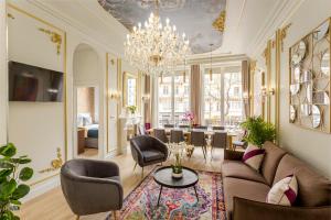 a living room with a couch and chairs and a chandelier at Luxury 5 Bedroom 4 Bathroom - Louvre & Notre Dame in Paris