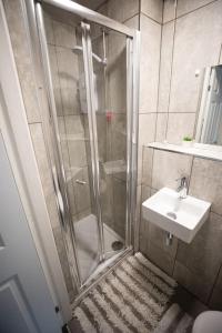 a bathroom with a shower and a sink at The Royalty in Sunderland