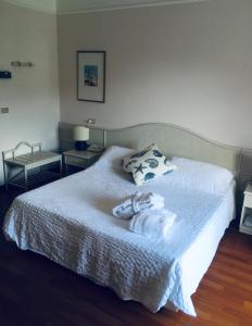 Postel nebo postele na pokoji v ubytování Hotel Abbazia