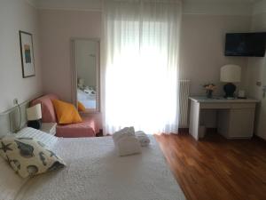 Postel nebo postele na pokoji v ubytování Hotel Abbazia