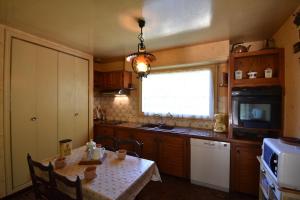 Køkken eller tekøkken på Sabilande - Seignosse situation agréable dans quartier calme et boisé proche de la plage et du lac d'hossegor