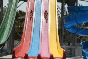 a group of colorful slides on a roller coaster at Anastasia Splash Residences in Protaras