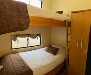 Postel nebo postele na pokoji v ubytování Cabañas & Spa Qamawi