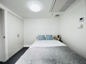 Katil atau katil-katil dalam bilik di Esperanza Resort Atami-エスペランサリゾート熱海