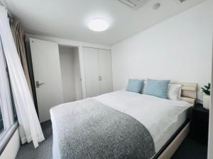 Katil atau katil-katil dalam bilik di Esperanza Resort Atami-エスペランサリゾート熱海