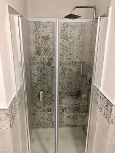 a shower with a glass door in a bathroom at Sapphire Penthouse in Tropea +24 photos
