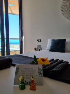 Łóżko lub łóżka w pokoju w obiekcie Ola Cotillo! Ver y Sentir el Mar desde casa