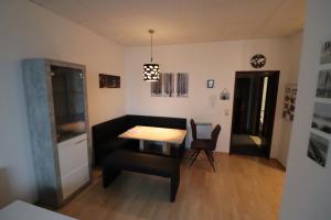 a dining room with a table and two chairs at Ferienwohnung GGM in Judenburg