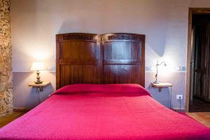 Postel nebo postele na pokoji v ubytování Agriturismo Bio Fattoria di Pietra