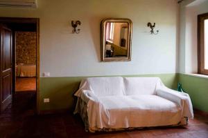 Postel nebo postele na pokoji v ubytování Agriturismo Bio Fattoria di Pietra
