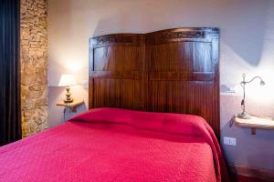 Postel nebo postele na pokoji v ubytování Agriturismo Bio Fattoria di Pietra