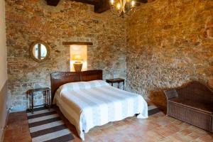 Postel nebo postele na pokoji v ubytování Agriturismo Bio Fattoria di Pietra