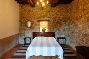 Postel nebo postele na pokoji v ubytování Agriturismo Bio Fattoria di Pietra