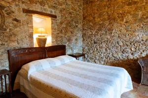 Postel nebo postele na pokoji v ubytování Agriturismo Bio Fattoria di Pietra