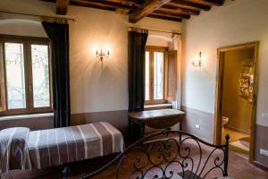 Postel nebo postele na pokoji v ubytování Agriturismo Bio Fattoria di Pietra