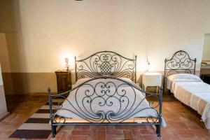 Postel nebo postele na pokoji v ubytování Agriturismo Bio Fattoria di Pietra