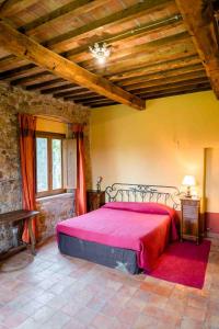 Postel nebo postele na pokoji v ubytování Agriturismo Bio Fattoria di Pietra