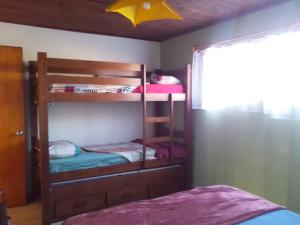 a bedroom with two bunk beds and a yellow star at hospedaje vicenzo in Melo