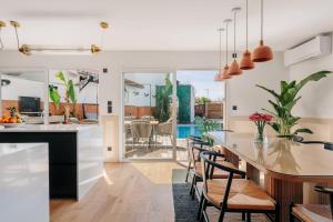 a kitchen and dining room with a table and chairs at Villa Horizonte - Biarritz in Biarritz