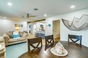 a living room and dining room with a table and chairs at Pet-Friendly Cocoa Beach Vacation Rental! in Cocoa Beach