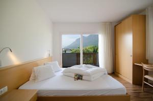 Postel nebo postele na pokoji v ubytování Garni Hotel Peterlinhof + 37 fotografií