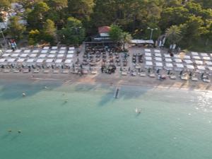 an aerial view of a beach with chairs and water at Meder Resort Hotel - Ultra All Inclusive in Kemer