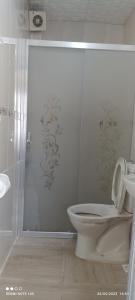 a white bathroom with a toilet and a shower at Bereket traveler Hotel in Istanbul +58 photos