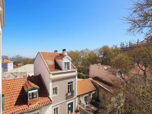 an overhead view of a building with red tile roofs at Mosteiro - Lissabon Altstadt in Lisbon