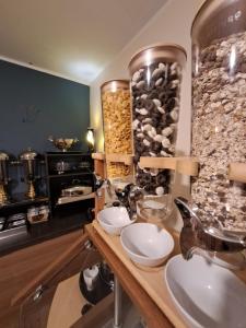 a bathroom with a counter with two sinks and a counter at Zwei Hirsche in Seefeld in Tirol