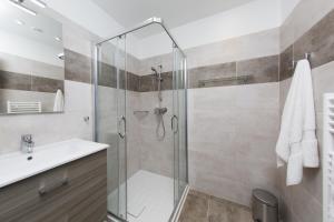 a bathroom with a shower and a sink at Résidence Hotelière Capu Seninu in Porto Ota +36 photos