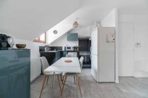Kuchyňa alebo kuchynka v ubytovaní Residence Le Languedoc - Appartements design - Proche des parcs