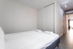 En eller flere senge i et værelse på Beach Tapas apartment by Costarentals - Ref 182