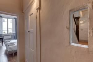 a room with a wall with a mirror on it at Ginori 3P in Florence +20 photos