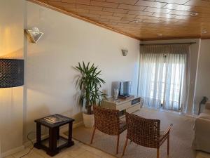 a living room with a couch and a table at Apartamento Ruy Belo - Foz in Vila do Conde