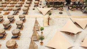 an overhead view of a courtyard with chairs and umbrellas at Ayan Luxury By Complex Almar in Mamaia Sat/Năvodari