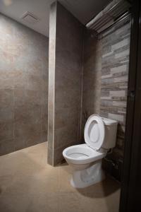 a bathroom with a white toilet in a room at Hotel Ambassador @ Bukit Bintang in Kuala Lumpur