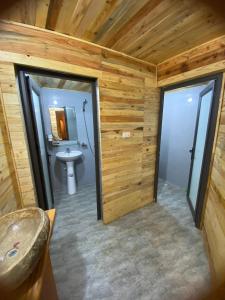 a bathroom with a toilet and a sink at A Phủ Home’s in Bắc Yên