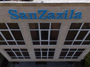 a sign on a santa zaza building at SanZazila in Gudauta