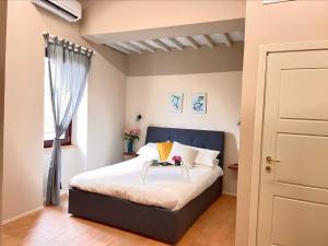 Postel nebo postele na pokoji v ubytování B&B La Fenice