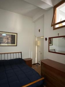 Ένα ή περισσότερα κρεβάτια σε δωμάτιο στο Monte Tauro Apartment