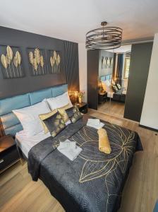 a bedroom with a large bed in a room at Apartament Black Diamond in Szklarska Poręba