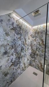 a wall with a floral mural on a wall at Infinity Suite in Peschici