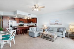 A seating area at Spacious Resort Condo with Breathtaking Gulf Views! by Dolce Vita Getaways PCB